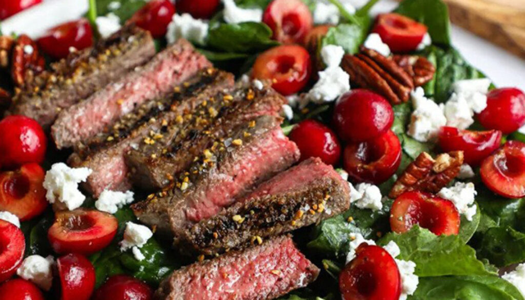 grilled-peppercorn-steak-and-caramelized-pecan-salad-with-cabernet-cherry-vinaigrette-recipe